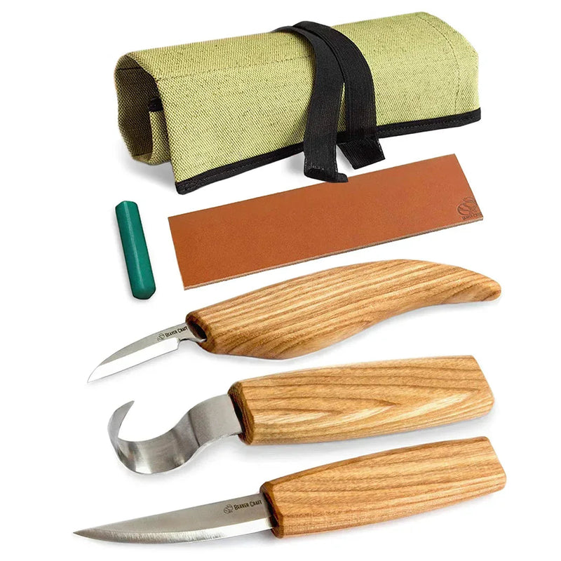 Set of carving kives including stright, detail, and curved spoon blades with strop and canvas case