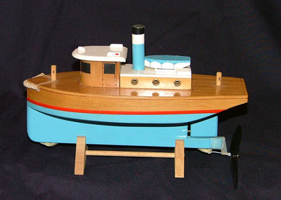 https://www.woodenboatstore.com/cdn/shop/products/tugboat-model-400_800x.jpg?v=1597681737